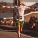Smiling runner enjoys the thrill of a marathon on a sunny day outdoors.