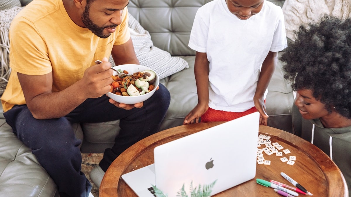 man in white crew neck t-shirt holding white ceramic bowl